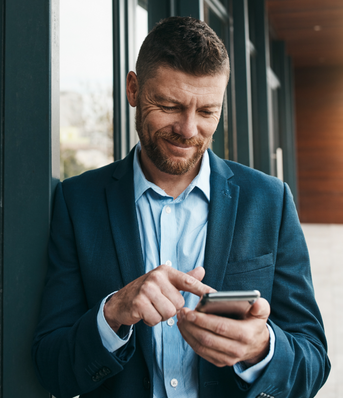 A lot operator checking the ParkAgent revenue dashboard on a phone.
